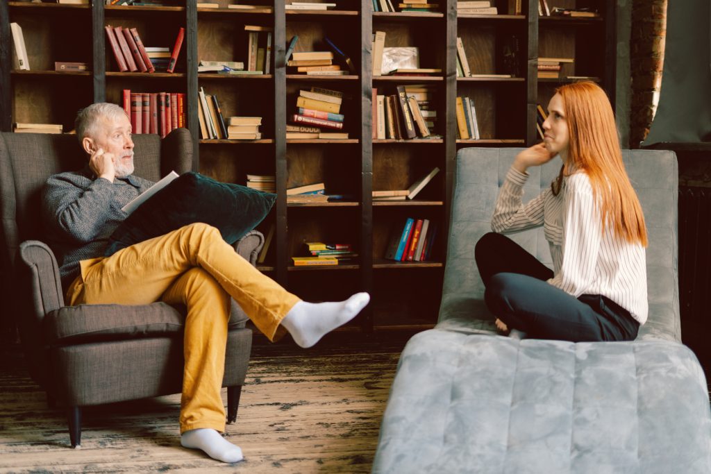 Therapist and client sitting across from each other in a counseling session, representing LGBTQ+ affirming therapy in Dallas