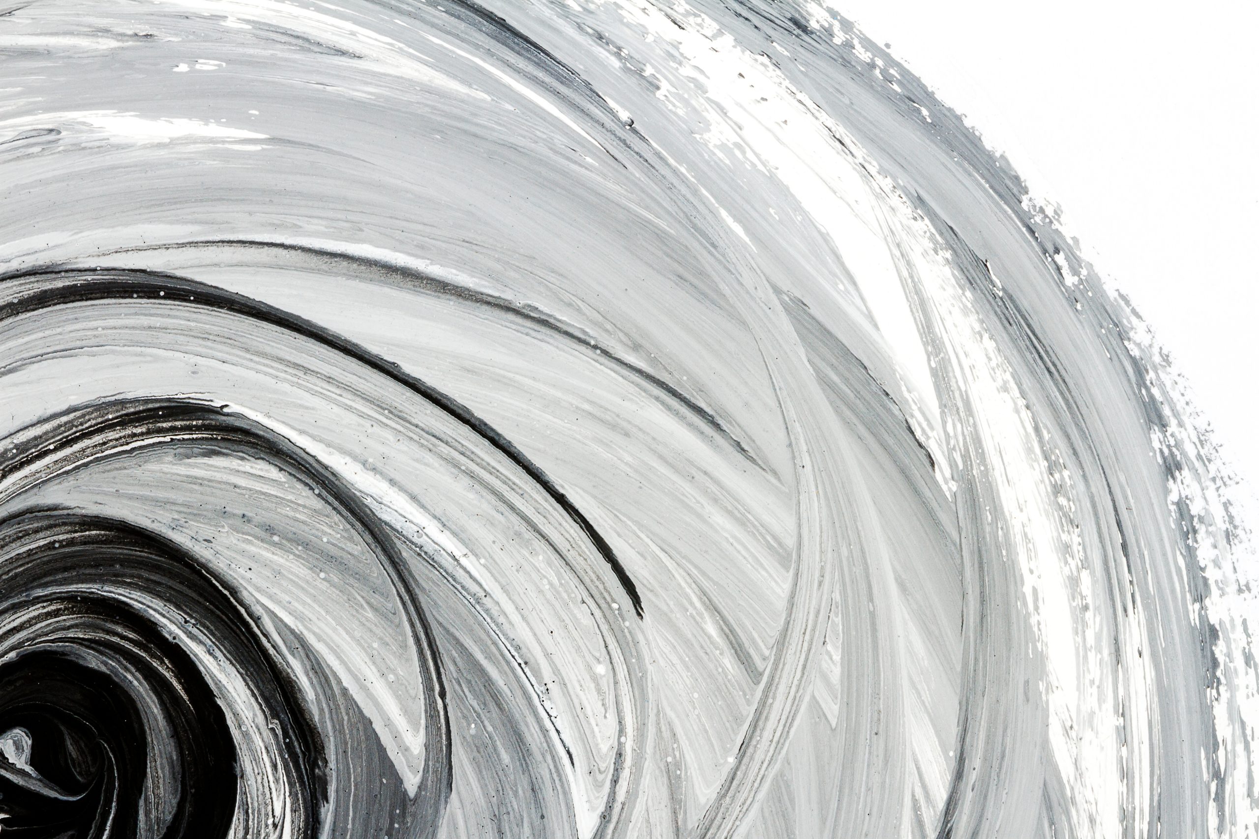 Abstract black-and-white spiral artwork representing the narrowing effects of trauma on perception and the journey toward restoring emotional resilience through trauma therapy in Dallas.