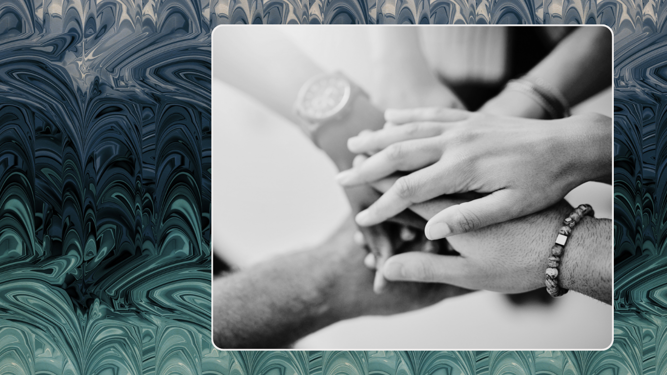 Multiple hands joined together representing connection, trust, and communication in ethical non-monogamy, polyamory, and open relationship therapy.